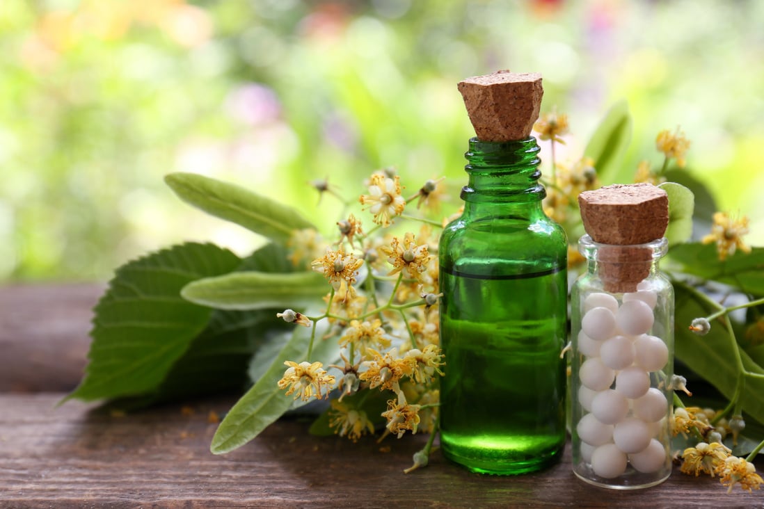 Tincture, Bottle of Homeopathic Remedy and Linden Flowers on Woo